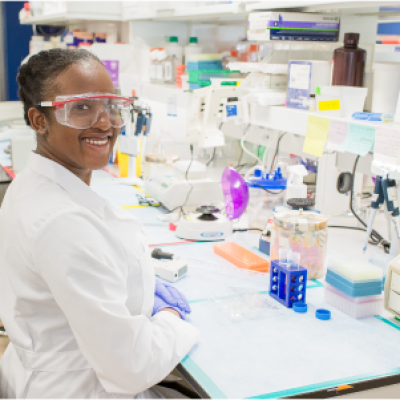 happy female scientist in NEI lab