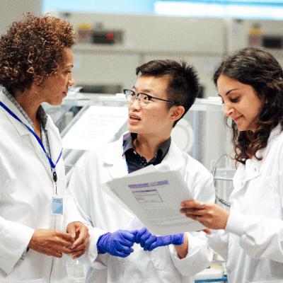 Three scientists talking.