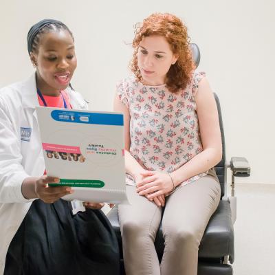 a doctor talks with a patient about eye disease