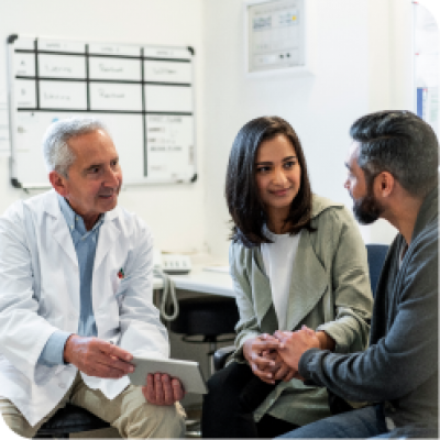 Couple talking to a doctor.