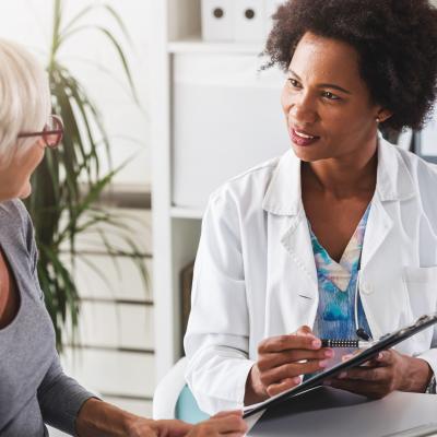 a doctor talks with a patient 