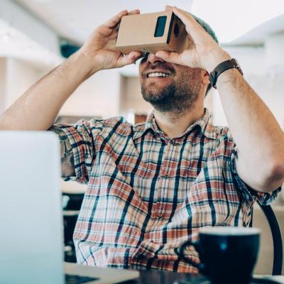 Man looking through a virtual reality device. 