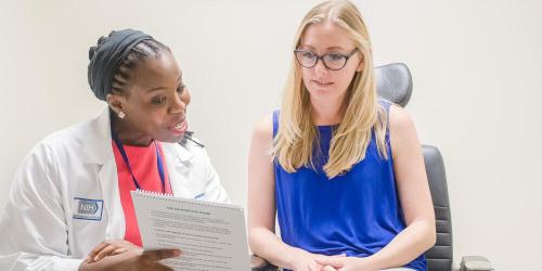 Doctor talks to patient.