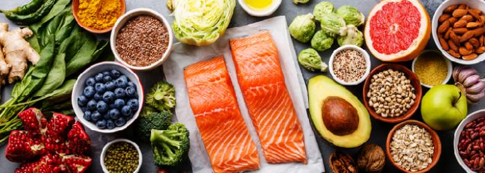 A variety of foods that are good for healthy vision like salmon and kale