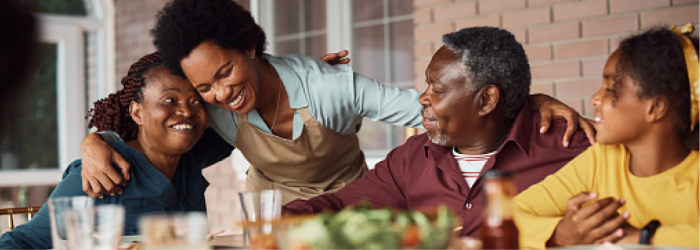 A family sits at table.