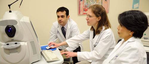 Doctors discuss a patient’s exam results