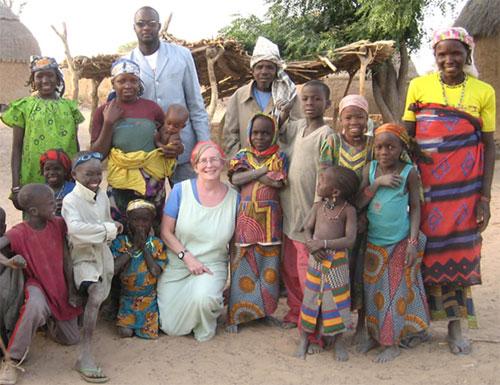 Dr. Sheila West (c) in Niger with children affected by trachoma.