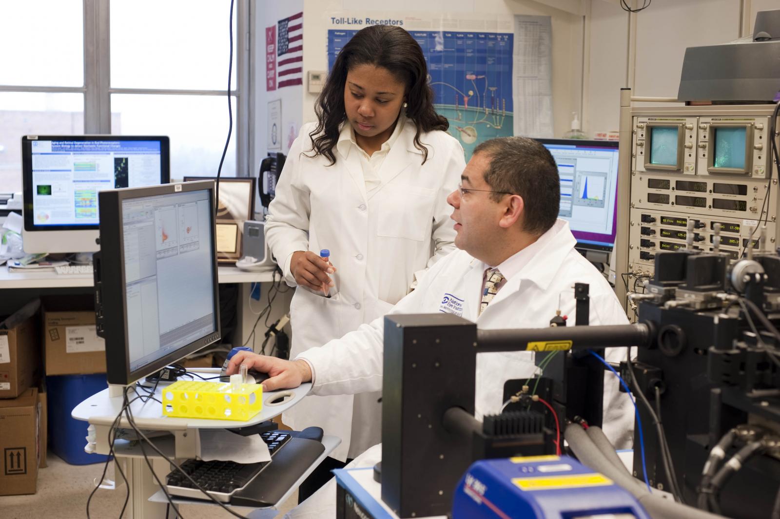 Researcher and student in laboratory