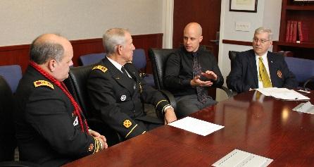 Hotaling and others sit around conference table