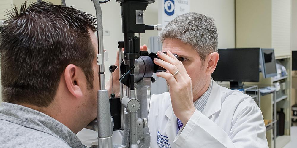 A person being examined by an eye doctor