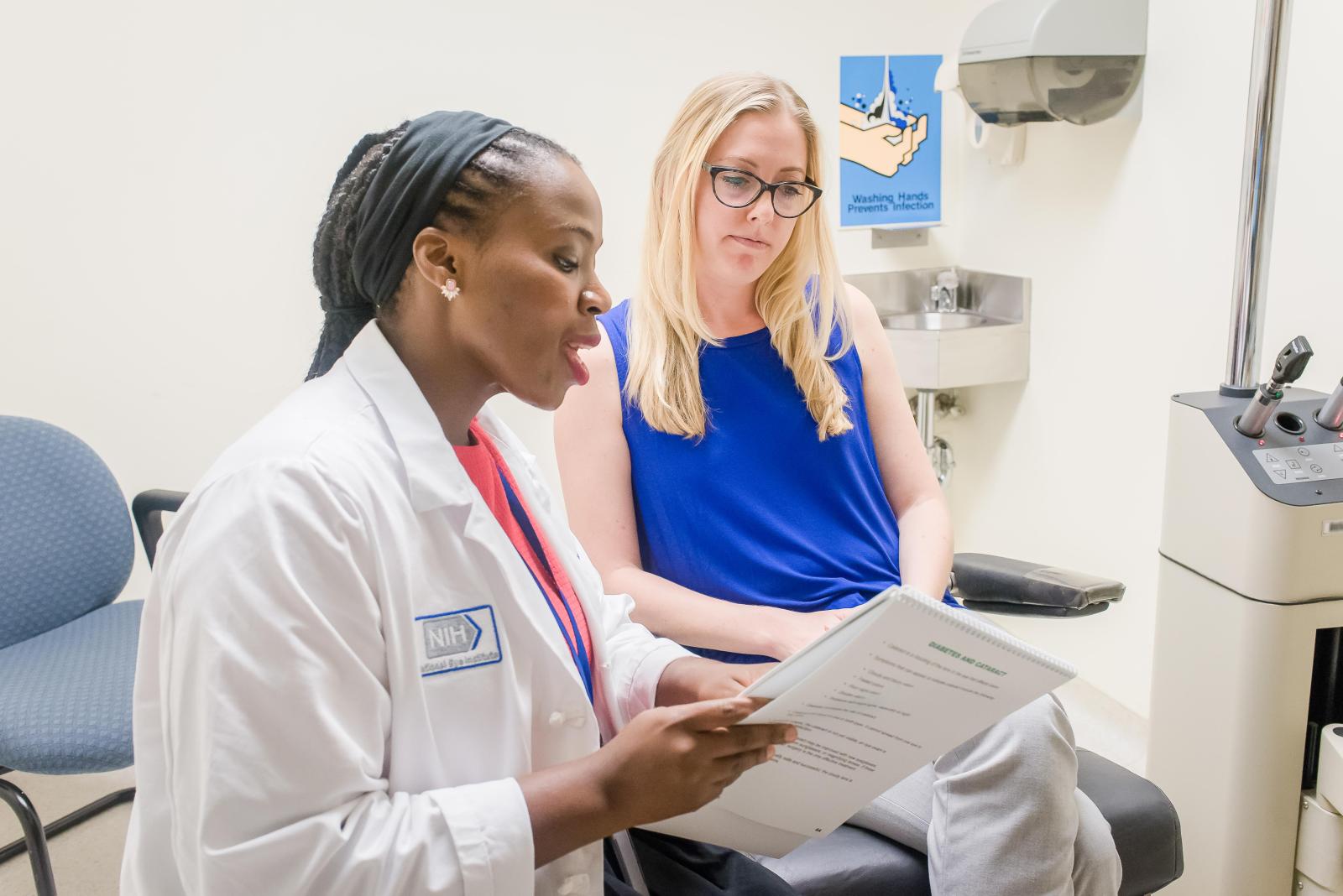 a clinical researcher talks with a study participant