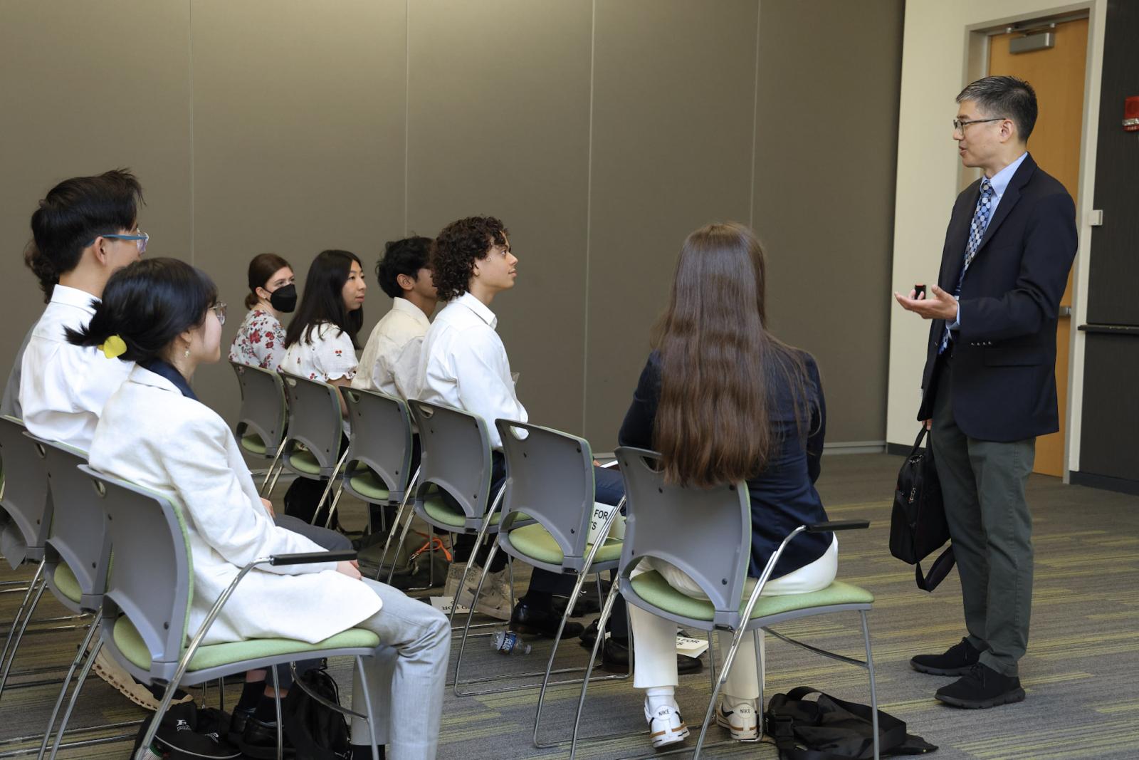 Michael Chiang speaks to students at Eye on the Future event.
