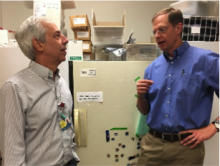 Two men chatting in a lab