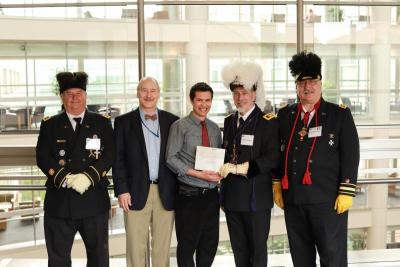 Oussama M’Hamdi, Ph.D. receiving award