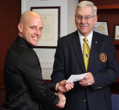 Nathan Hotaling receiving check