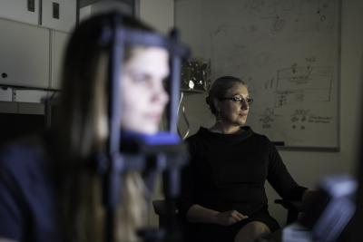 Krystel Huxlin with patient in laboratory
