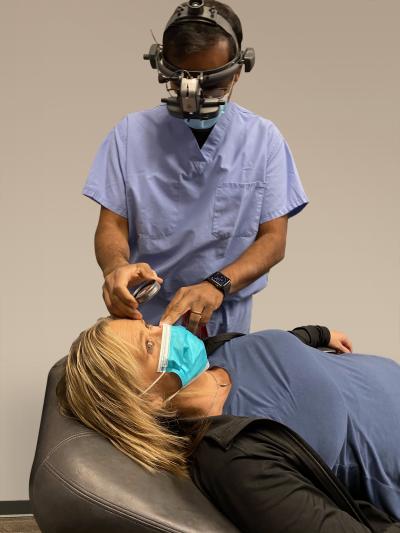 Doctor examining woman's eye