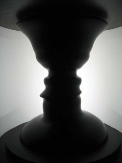 Optical illusion showing a vase or two faces