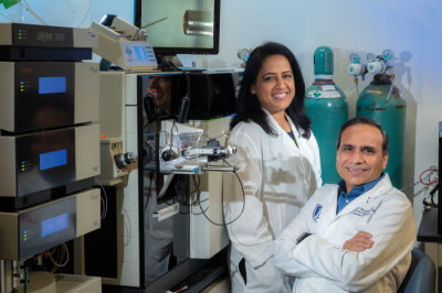 Shruti Sharma and Ashok Sharma in the laboratory.