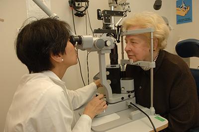 Dr. Emily Chew conducts an eye exam