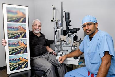 Raj Maturi sits with patient, holding a series of photos of increasing clarity.