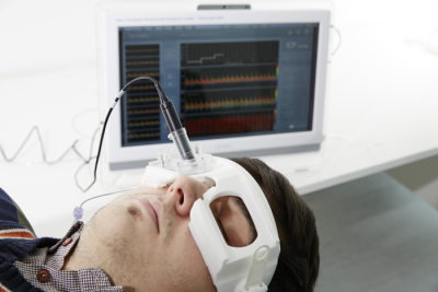 Patient wearing brain pressure measuring device over their eyes.