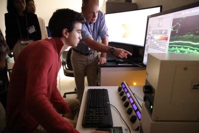 Student working at a microscope