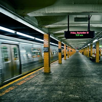 New York subway with moving train.