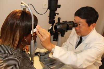 Doctor giving eye exam