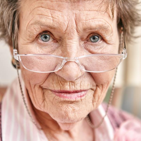An older woman with glasses looking at the camera.