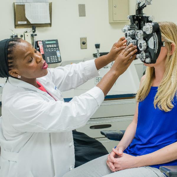 Woman getting an eye exam.
