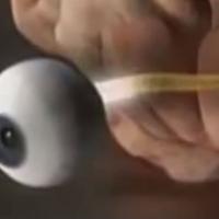 Computerized image of an eyeball, optic nerve and brain.