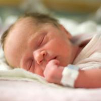 Small baby sleeping in hospital.
