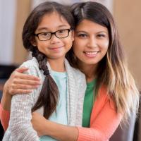 Mother and her daughter smile for the camera