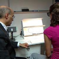 Girl and physician conducting CI exam