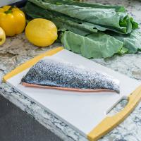 Vegetables and fish on kitchen counter