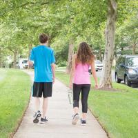 two people are taking a walk outside