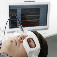 Patient wearing brain pressure measuring device over their eyes.