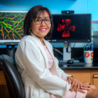 Thounaojam with retinal images in background.