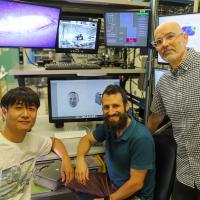Yu Gongchen, Leor Katz, and Rich Krauzlis in the lab. 
