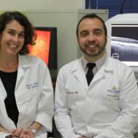 Dr. Rachel Bishop and Dr. Allen Eghrari, from the Johns Hopkins University Wilmer Eye Institute, shown here with the advanced imaging technologies being used for the PREVAIL III study in Monrovia, Liberia.